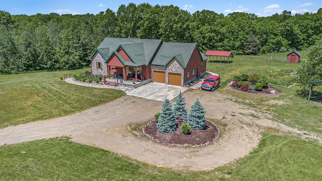 view of front of house with a front lawn, a porch, and a garage