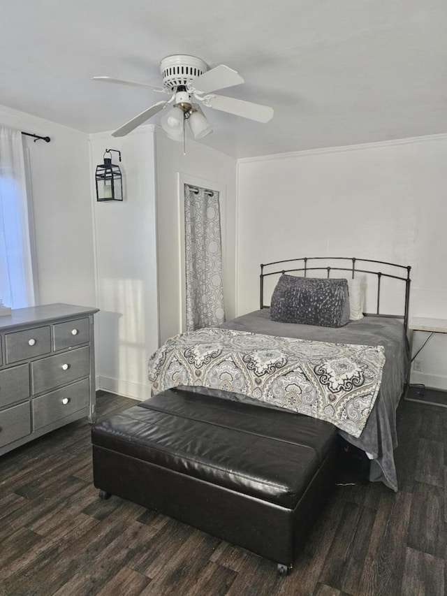 bedroom with ceiling fan and dark wood-type flooring