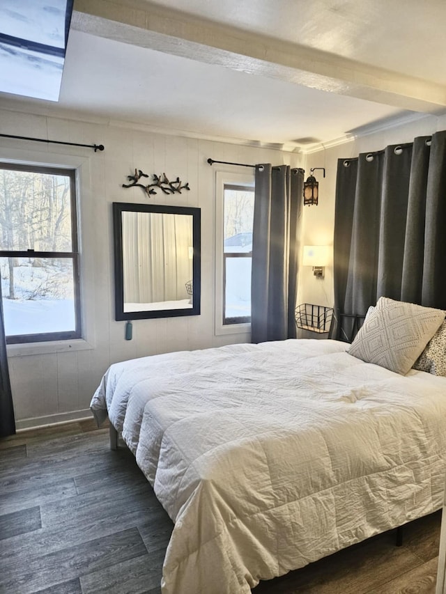 bedroom featuring dark wood finished floors