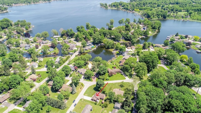 birds eye view of property with a water view