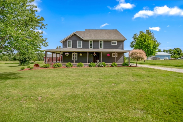 view of front of house with a porch and a front yard