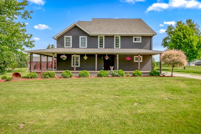 view of front of home featuring covered porch and a front lawn