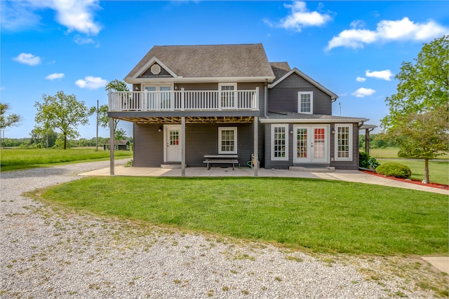 back of house with a lawn, a patio area, french doors, and a deck