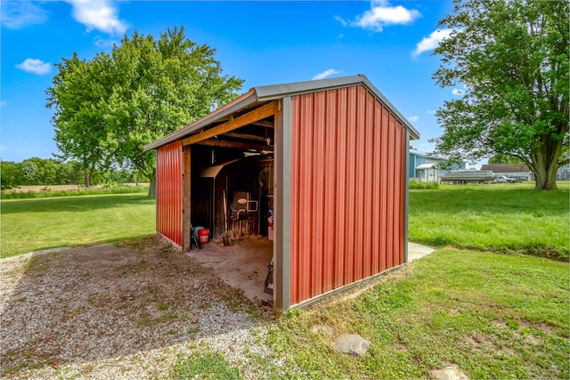 view of outbuilding with a lawn