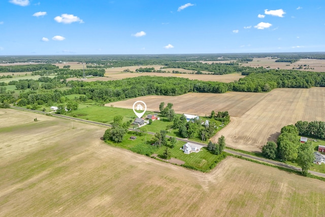 birds eye view of property with a rural view