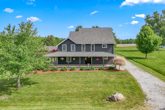 view of front of home featuring covered porch and a front yard