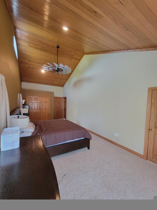 carpeted bedroom featuring ceiling fan, wood ceiling, ornamental molding, and vaulted ceiling