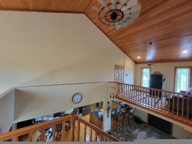 corridor featuring lofted ceiling and wood ceiling