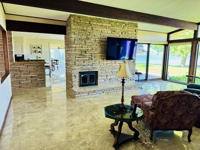 7206 Beechwood Cir, Watervliet, MI 49098 - living area with beam ceiling, a fireplace, and marble finish floors