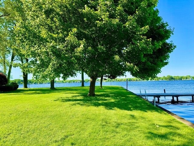 7206 Beechwood Cir, Watervliet, MI 49098 - surrounding community featuring a yard, a boat dock, and a water view