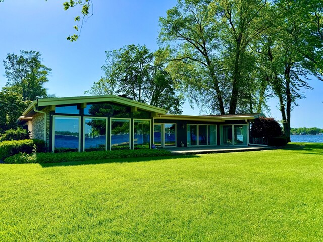 7206 Beechwood Cir, Watervliet, MI 49098 - rear view of house featuring a yard and a sunroom