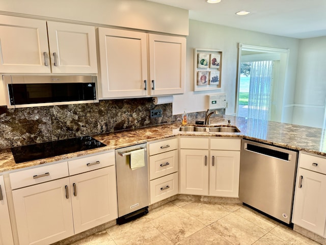 7206 Beechwood Cir, Watervliet, MI 49098 - kitchen with stainless steel appliances, a sink, stone counters, white cabinets, and recessed lighting