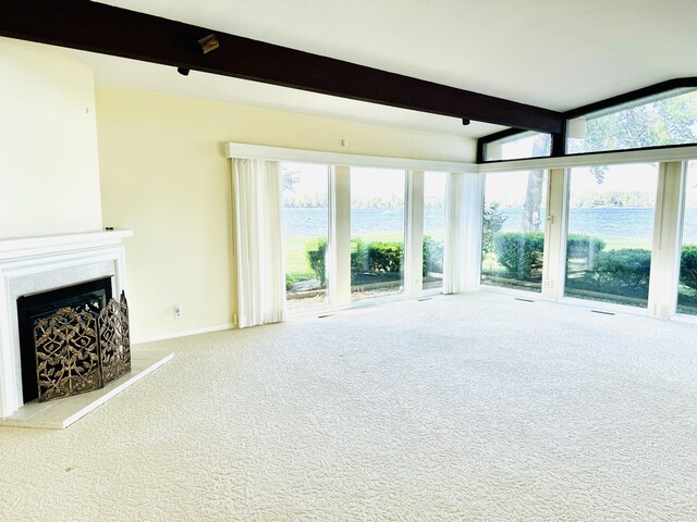 7206 Beechwood Cir, Watervliet, MI 49098 - unfurnished living room with beam ceiling, carpet floors, healthy amount of natural light, a water view, and a fireplace
