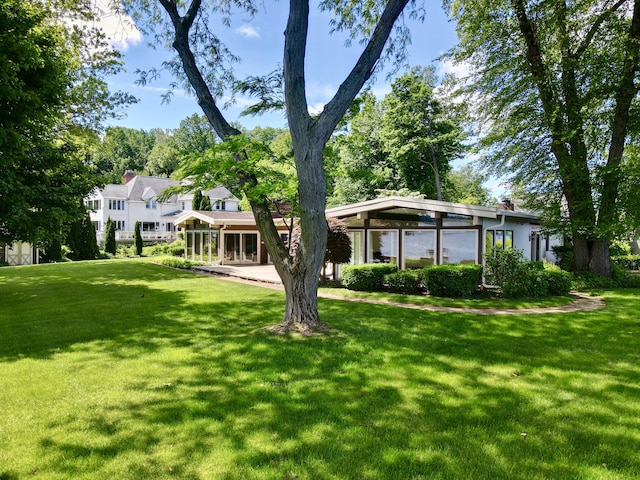 7206 Beechwood Cir, Watervliet, MI 49098 - rear view of property featuring a lawn