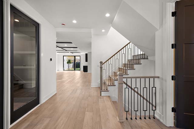 hall with light hardwood / wood-style flooring