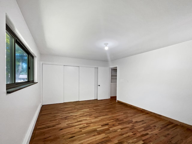 2645 Hickory, Bloomfield Hills, MI 48302 - unfurnished bedroom with wood finished floors, baseboards, and a closet