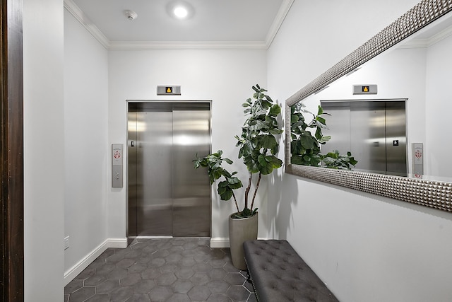 corridor with elevator, dark tile patterned floors, and ornamental molding