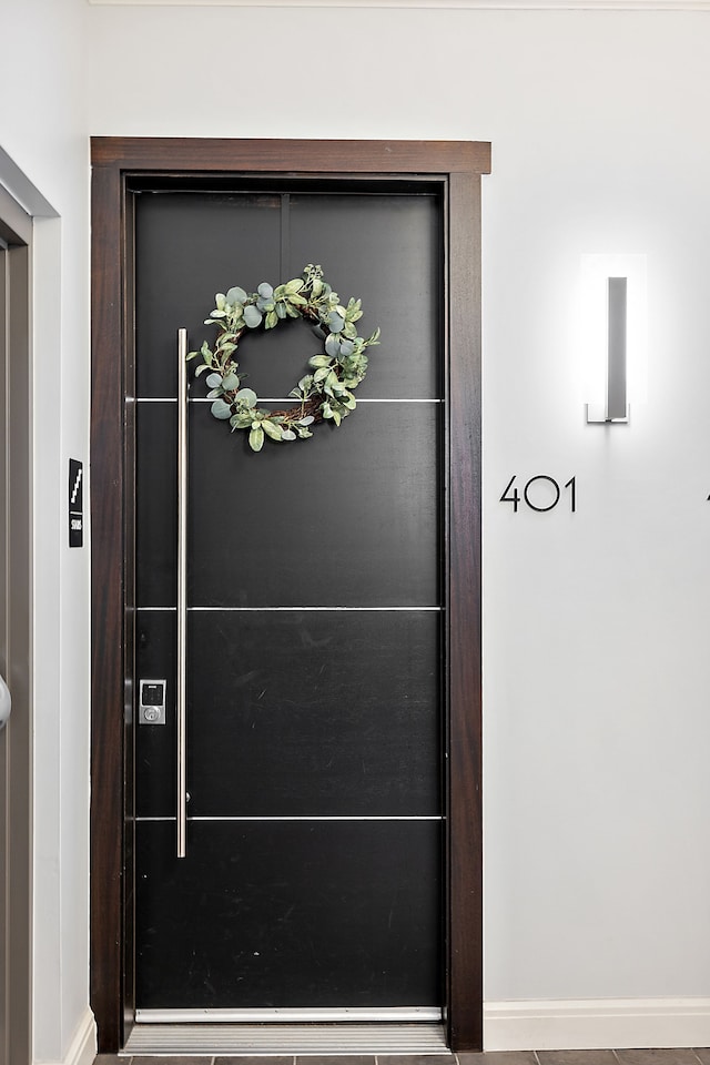 view of exterior entry featuring elevator