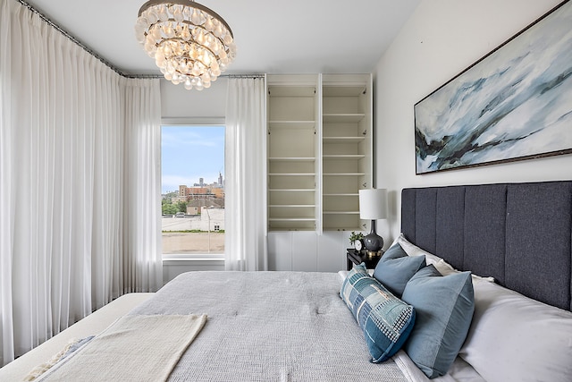 bedroom with a notable chandelier