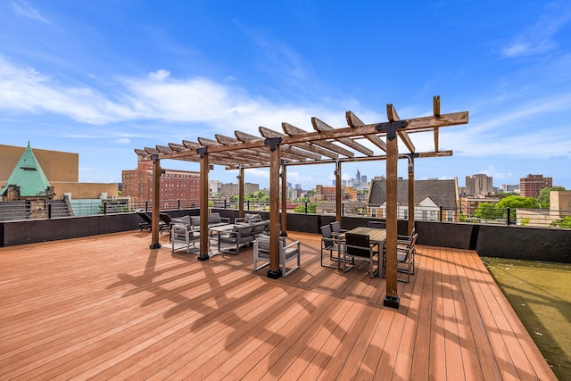 deck with a pergola, an outdoor living space, and a city view