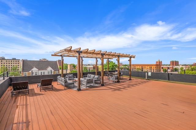 wooden deck with an outdoor living space and a pergola