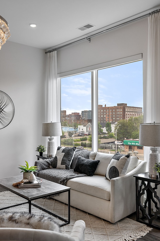 living area featuring a view of city and visible vents