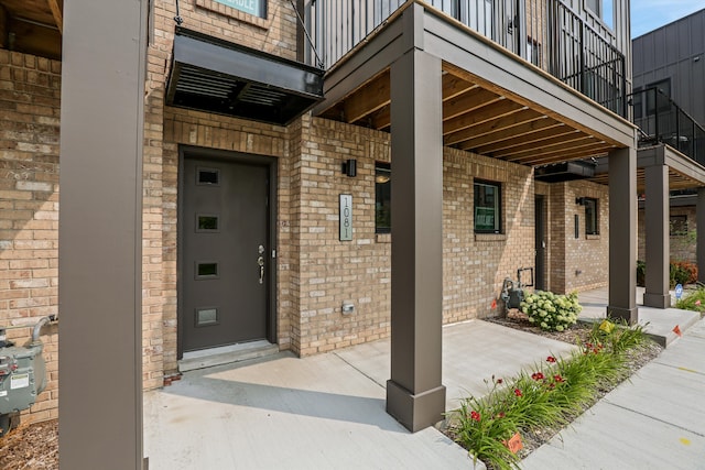 entrance to property featuring a balcony