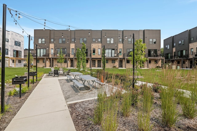 view of home's community with a patio area