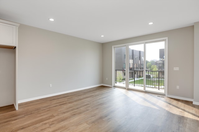 interior space featuring access to exterior and light hardwood / wood-style floors