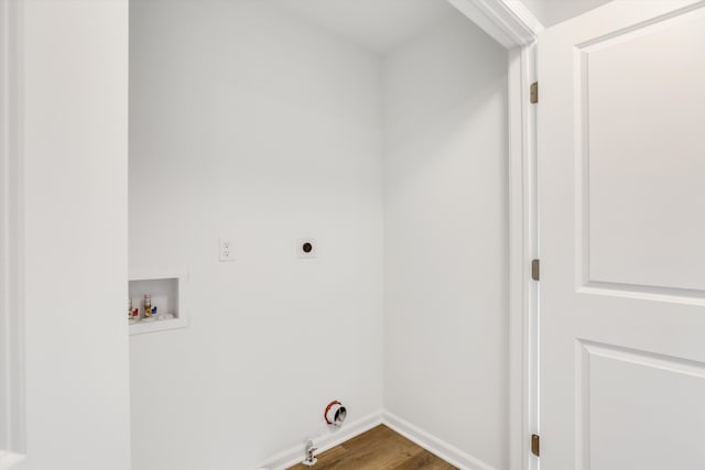 laundry room featuring hardwood / wood-style floors, electric dryer hookup, gas dryer hookup, and hookup for a washing machine