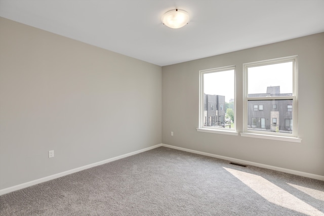 unfurnished room featuring carpet