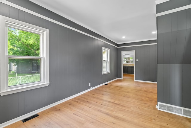 1114 Church St, Port Huron, MI 48060 - empty room with wood finished floors, ornamental molding, and baseboards