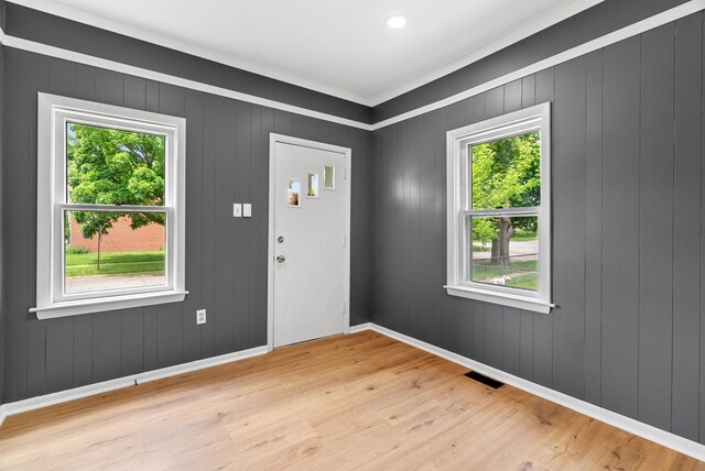 1114 Church St, Port Huron, MI 48060 - entryway featuring healthy amount of natural light, light wood-style floors, baseboards, and crown molding