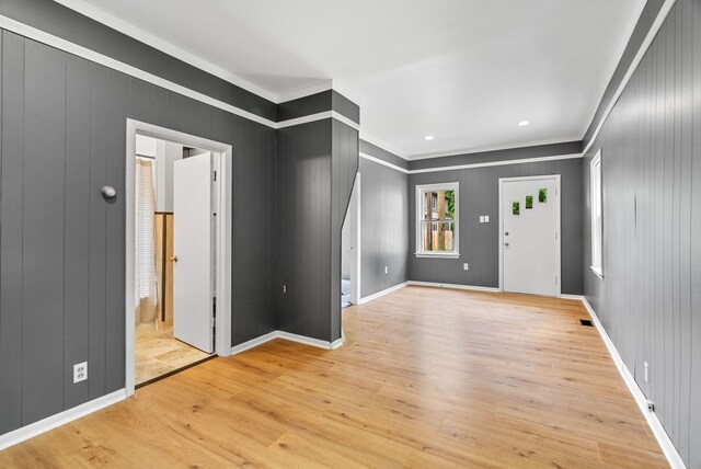 1114 Church St, Port Huron, MI 48060 - entryway with crown molding, light wood finished floors, and baseboards