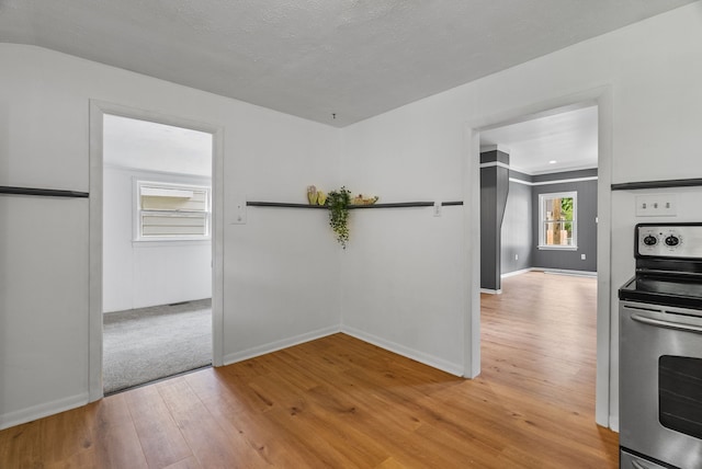 1114 Church St, Port Huron, MI 48060 - unfurnished dining area featuring light wood finished floors and baseboards