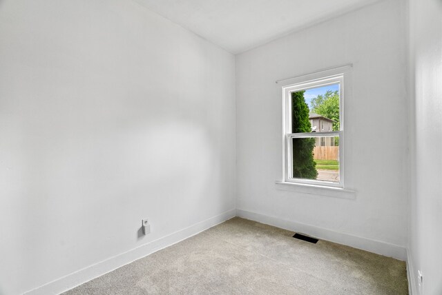 1114 Church St, Port Huron, MI 48060 - empty room with light colored carpet and baseboards