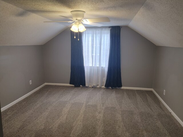 11675 Forrer St, Detroit, MI 48227 - bonus room with a textured ceiling, lofted ceiling, a ceiling fan, carpet floors, and baseboards