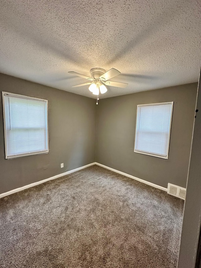 11675 Forrer St, Detroit, MI 48227 - empty room featuring carpet, a ceiling fan, baseboards, and a textured ceiling