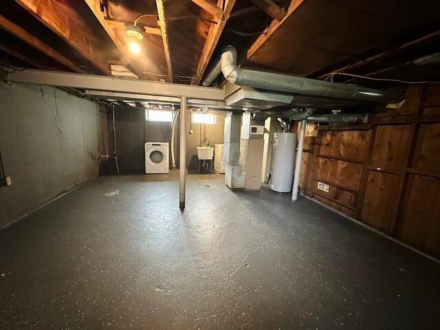 11675 Forrer St, Detroit, MI 48227 - below grade area featuring gas water heater, washer / dryer, a sink, and heating unit