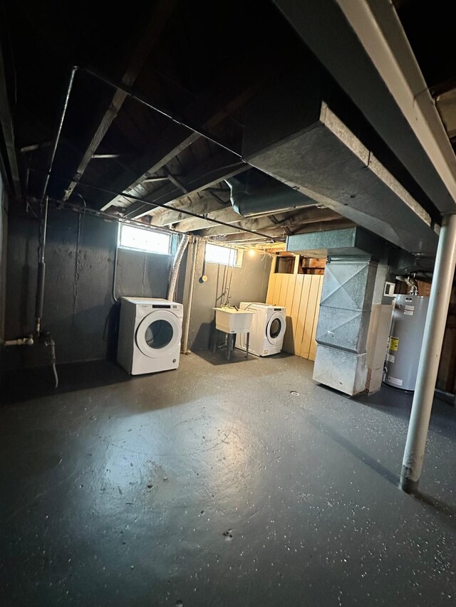 11675 Forrer St, Detroit, MI 48227 - below grade area featuring gas water heater, a sink, heating unit, and separate washer and dryer
