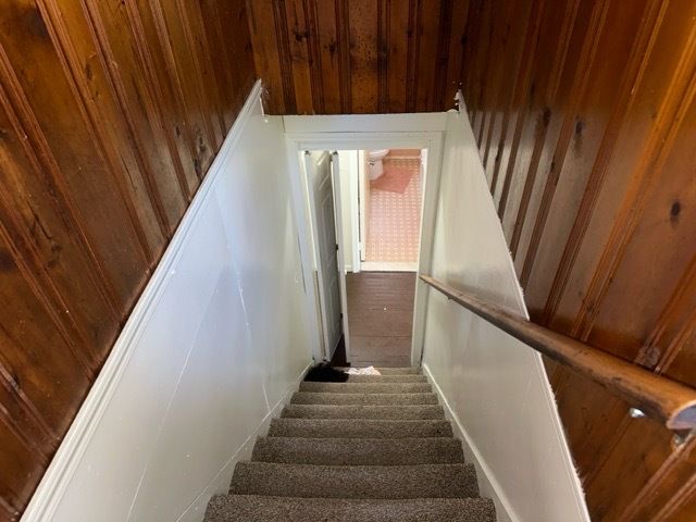 18659 Shaftsbury Ave, Detroit, MI 48219 - stairs featuring carpet flooring