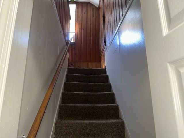 18659 Shaftsbury Ave, Detroit, MI 48219 - stairs featuring wood walls