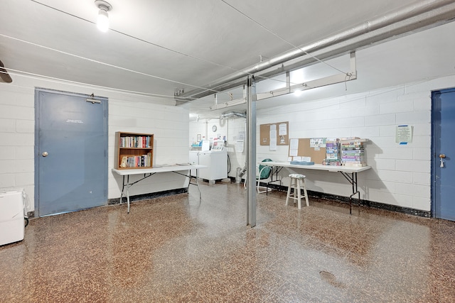 garage with washing machine and dryer