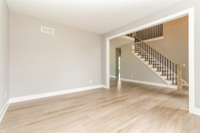 unfurnished living room with light wood-type flooring