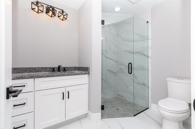 bathroom featuring vanity, toilet, and walk in shower