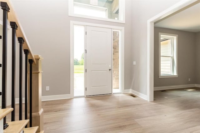 entrance foyer with light hardwood / wood-style floors