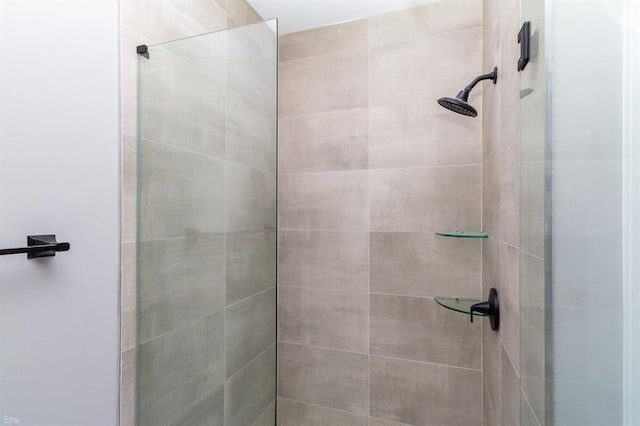 bathroom with tiled shower