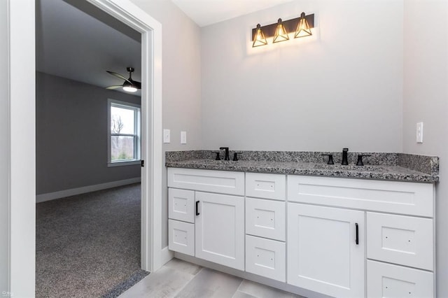 bathroom featuring vanity and ceiling fan