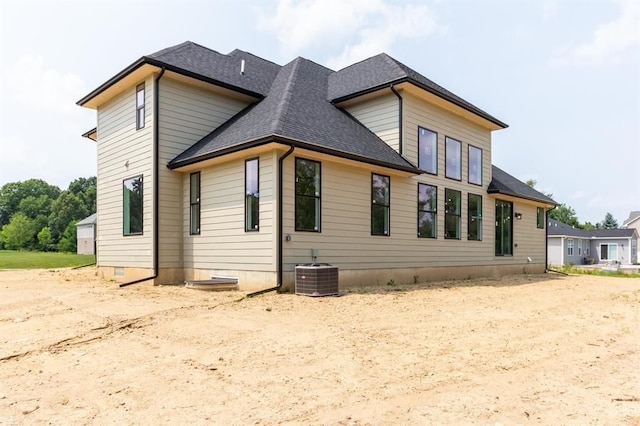 rear view of property featuring central air condition unit