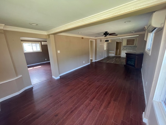 unfurnished living room featuring crown molding, ceiling fan, and dark wood-type flooring